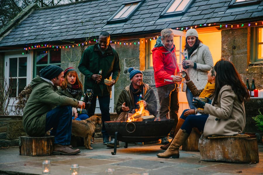 Friends Enjoying Beer Together During The Holidays