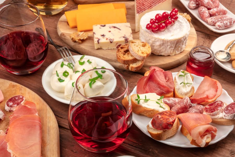Red wine with a meat and cheese platter